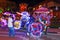Colourful trishaws decorated with bright multi-colour lights and cartoon pictures in Malacca