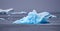 Colourful turquoise icebergs swimming in antarctic ocean