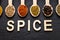 Colourful various herbs and spices on dark background