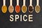 Colourful various herbs and spices on dark background