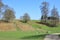 Colourful view of the Sevenoaks countryside with green fields and deer grazing