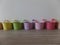 Colourful vintage style ice cream pots and matching spoons