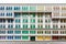 Colourful window shutters of the old building.