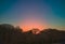 Colourful winter evening skies through the English woodland