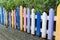 Colourful wood fence in small garden