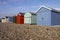 Colourful wooden beach huts on a sunny day on Hayl