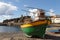 Colourful wooden fishing boat on beach