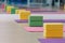 Colourful yoga blocks and mats place on wooden texture floor. Ready for yoga class