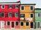 Colourfull painted houses on a street in burano in venice
