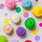 Colourfull rainbow cupcakes with confetti flat lay