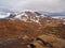 colourfull rhyoliet KerlingarfjÃ¶ll volcanic mountains in geothermal area in iceland with snow tangues and green moss