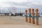 Colourfully painted wooden bollards at Geelongâ€™s Eastern Beach waterfront precinct