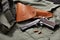 Colt gun pistol, holster and belt lie on military jacket