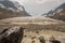 Columbia Icefield melting , with people walking passed