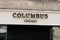 Columbus Cafe & Co brand logo and text sign front of French facade coffee and fastfood