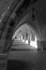 Column and arched passage of an old antique church.Black and white