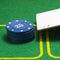 Column of blue poker chips and a falling ace of diamonds