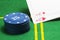 Column of blue poker chips and two falling ace