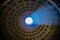 A column of light through a round hole in the dome. Pantheon.