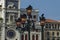 Column with lion of St Mark, symbol of imperial Venice, Zodiac clock Tower and Mother of God in San Marco`s square on the buildin