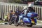 A column of motorcycles ride along the road, a motorcycle view from behind, a motor tour