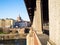 Column of Ponte Coperto bridge and view of Pavia