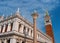 The column of St. Theodore and the bell tower of St. Mark-Campanile-in the center of Venice. In the background, the