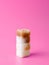 Column of sugar cubes  on pink