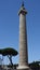 Column of Trajan towering over Trajan`s Forum in Rome