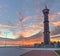 Column with weathervane on background of sunset