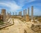 Columns against blue sky at ancient Roman ruins of Leptis Magna on the Mediterranean coast of Libya in North Africa