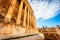 Columns of ancient Roman temple of Bacchus with surrounding ruins and blue sky in the background, Beqaa Valley, Baalbeck, Lebanon