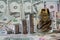 Columns of coins and glass jar with coins on a background of dollar banknotes. The concept of financial growth. Savings growth