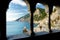 Columns of famous gothic Church of St. Peter with beautiful shoreline scenery in Porto Venere village, Liguria, Italy