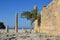 Columns on the hellenistic stoa of the Acropolis of Lindos, Rhodes, Greece, Blue sky, olive tree and beatiful sea view in the back