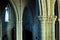 Columns inside a gothic church, stone, arches, religious architecture