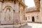 Columns and majestic arches of Orchha Fort in India