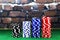 Columns of poker chips on green poker table