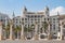 Columns in the port of alicante, spain with the carbonell house