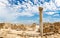 Columns and ruins of ancient Kourion with clouds and blue sky, E