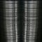 columns of shiny silver coloured metallic stainless steel plates