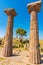 Columns of Temple of Athena and tourists in Assos ancient city