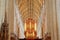 The columns and the vaulted roof of the cathedral viewed from the presbytery with the organ in the background