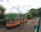 COLYTON, DEVON, ENGLAND - AUGUST 6TH 2012: An orange and green tram sits empty in Colyford station on the Seaton tramway