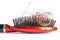 Comb hair with tufts, bundle of hair, lots of hair on the hairbrush close up on a white