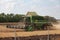 Combain harvester mows wheat