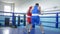Combative sports, Young Boxers guys Practice punches on workout before contest on Ring at sports Complex