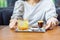 A combination between fresh Coffee, Lemon, Orange Soda on the stainless plate on wood table in front of blur woman in Coffee cafe