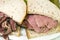 Combination pastrami corned beef on rye sandwich