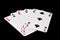 The combination of playing cards in poker on black background - Four of a Kind